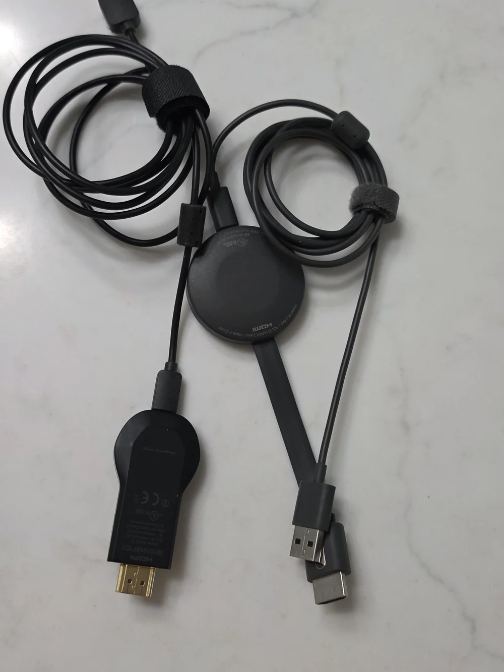 2 - Google Chromecast adapters and HDMI dongles in black